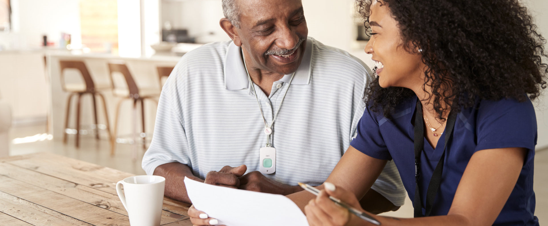 happy caregiver and senior man